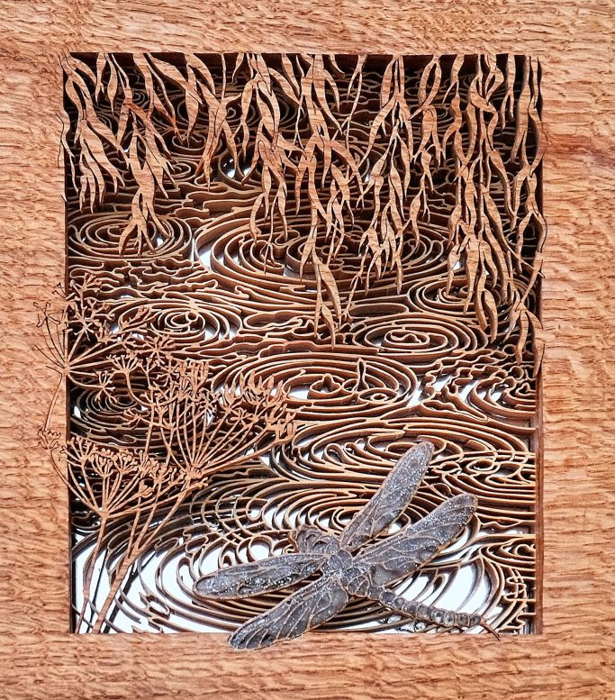 Pierced wooden riverside side scene 