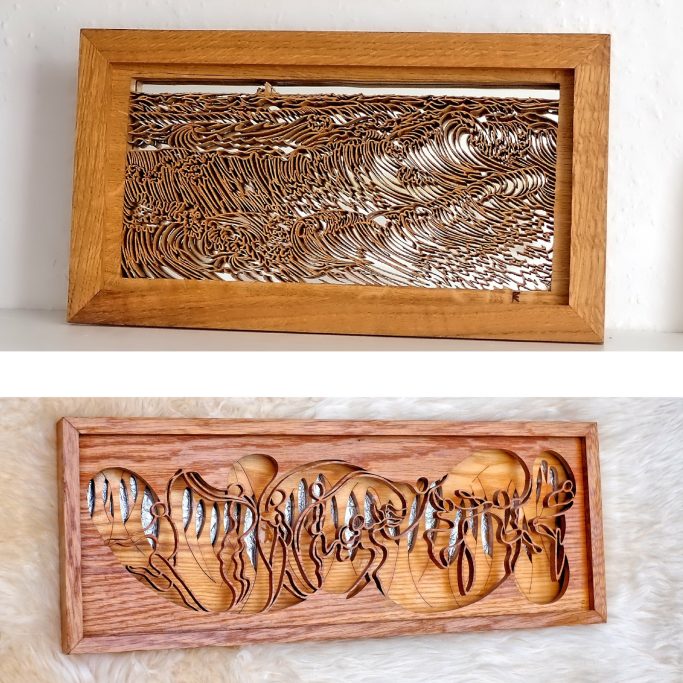 Two framed wood carvings showcasing intricate patterns and designs.