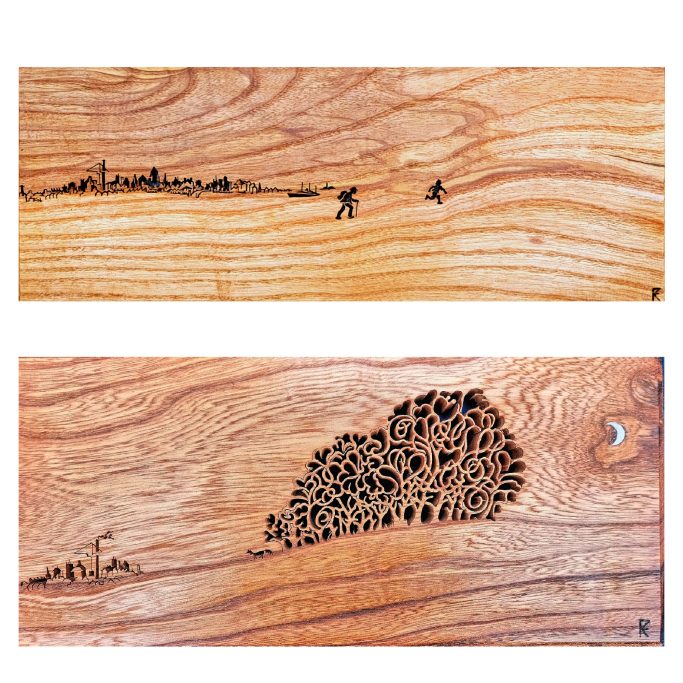 Wooden panels featuring intricate carvings of landscapes and tree silhouettes.