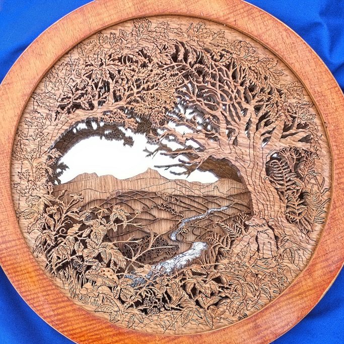 Finely cut wooden landscape with animals trees and fields