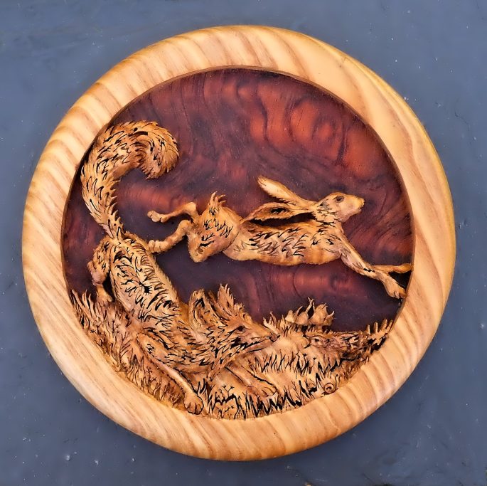 Hand carved wooden fox and hare roundel