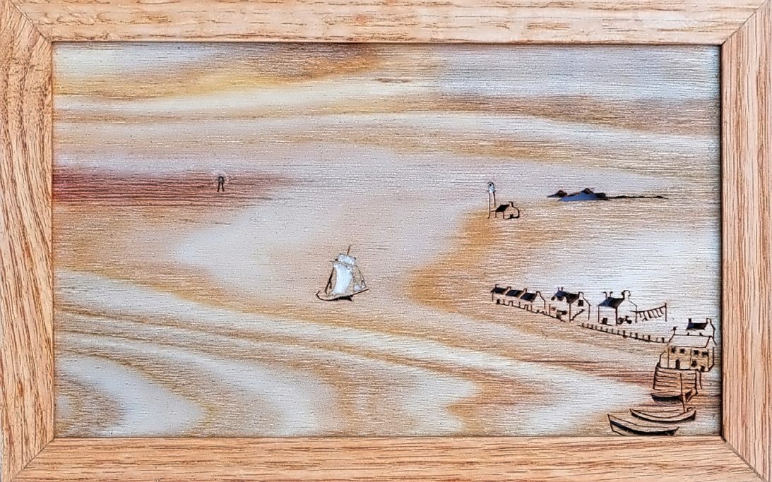 Wooden silhouette of a seascape including boats and a harbour