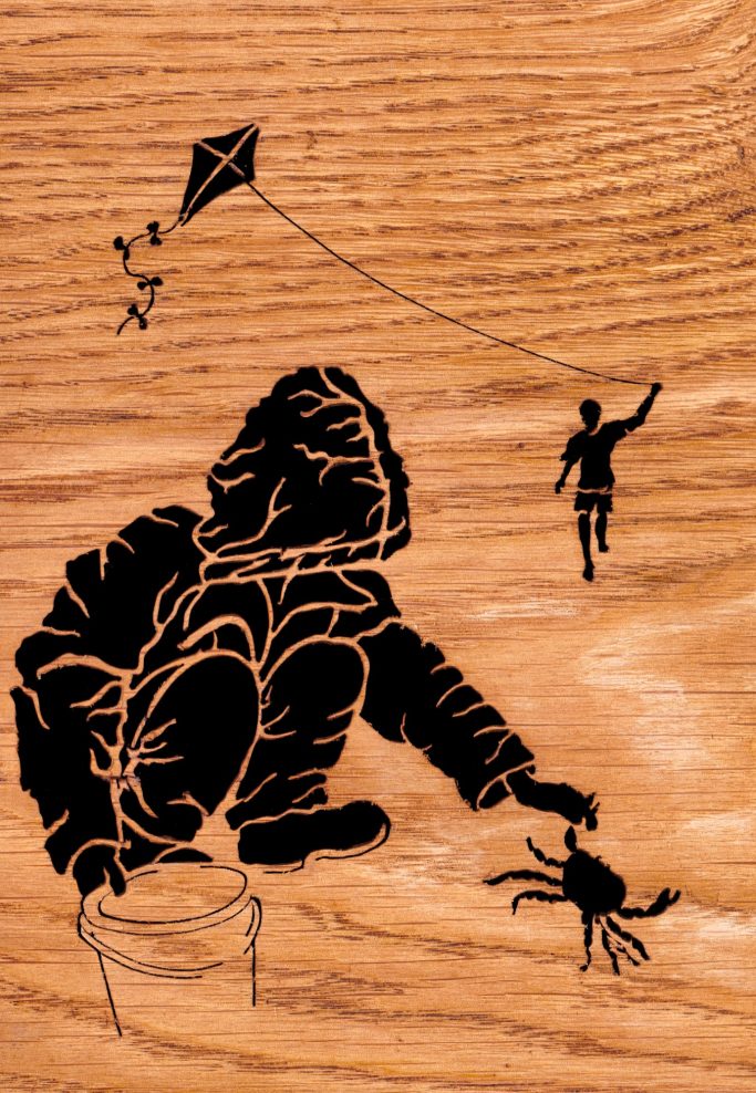 A child in a hoodie reaches for a crab while another person flies a kite above them. Wood silhouette